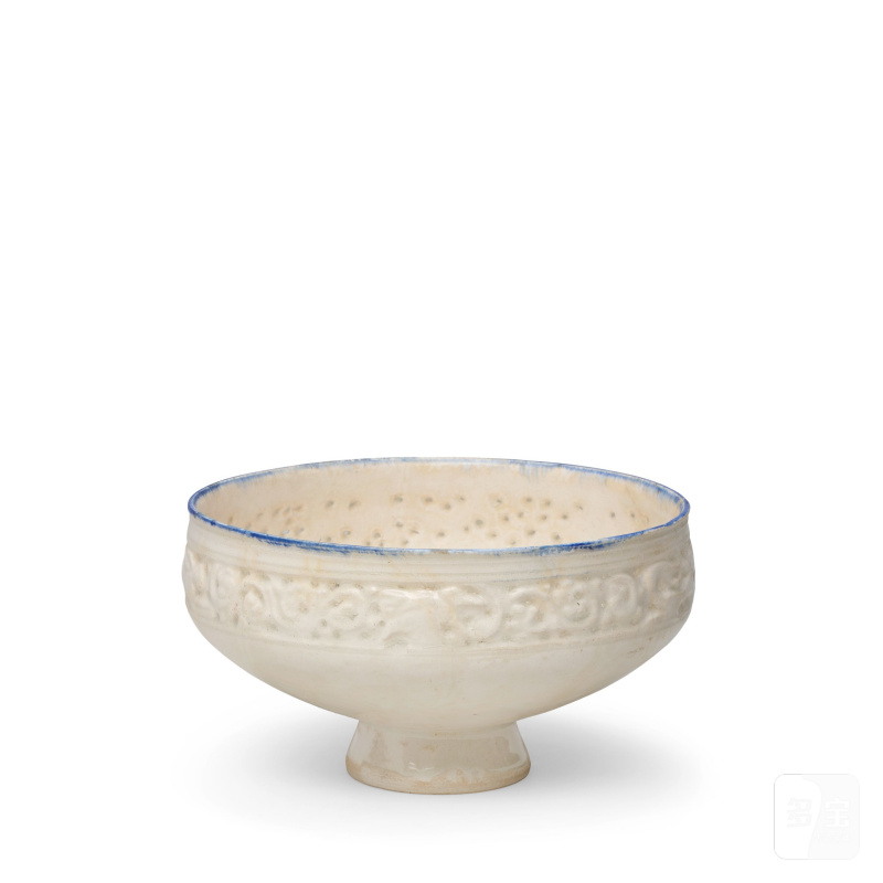 A moulded and pierced pottery bowl